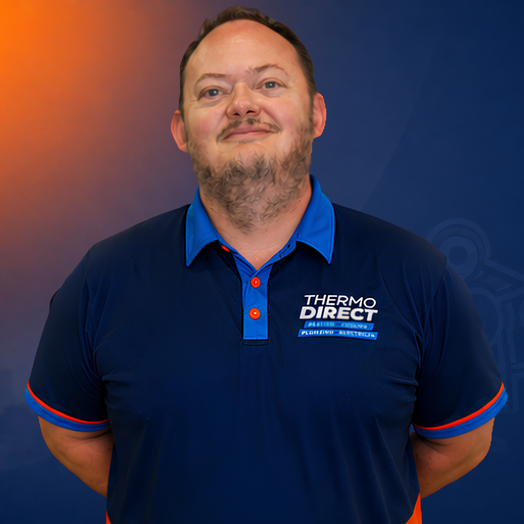 Meet the team: A man in a blue Thermo Direct polo shirt stands against a blue and orange background, facing the camera with his hands behind his back.